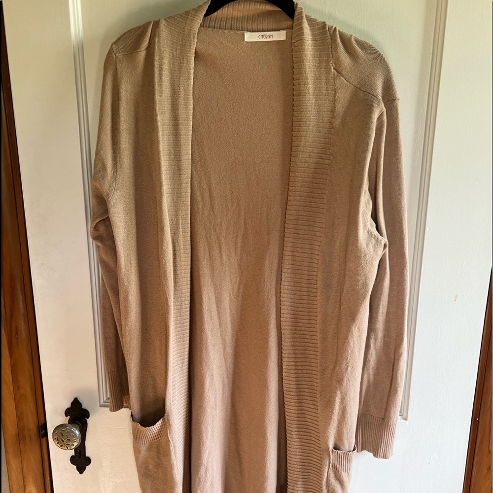 Boutique cardigan with pockets. Never worn.